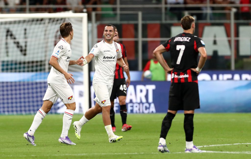 MILAN, ITALY - AUGUST 23: Luka Modric of AC Milan runs with the ball whilst under pressure from David Okereke of Cremonese during the Serie A match between AC Milan and US Cremonese at Giuseppe Meazza Stadium on August 23, 2025 in Milan, Italy. (Photo by Marco Luzzani/Getty Images)