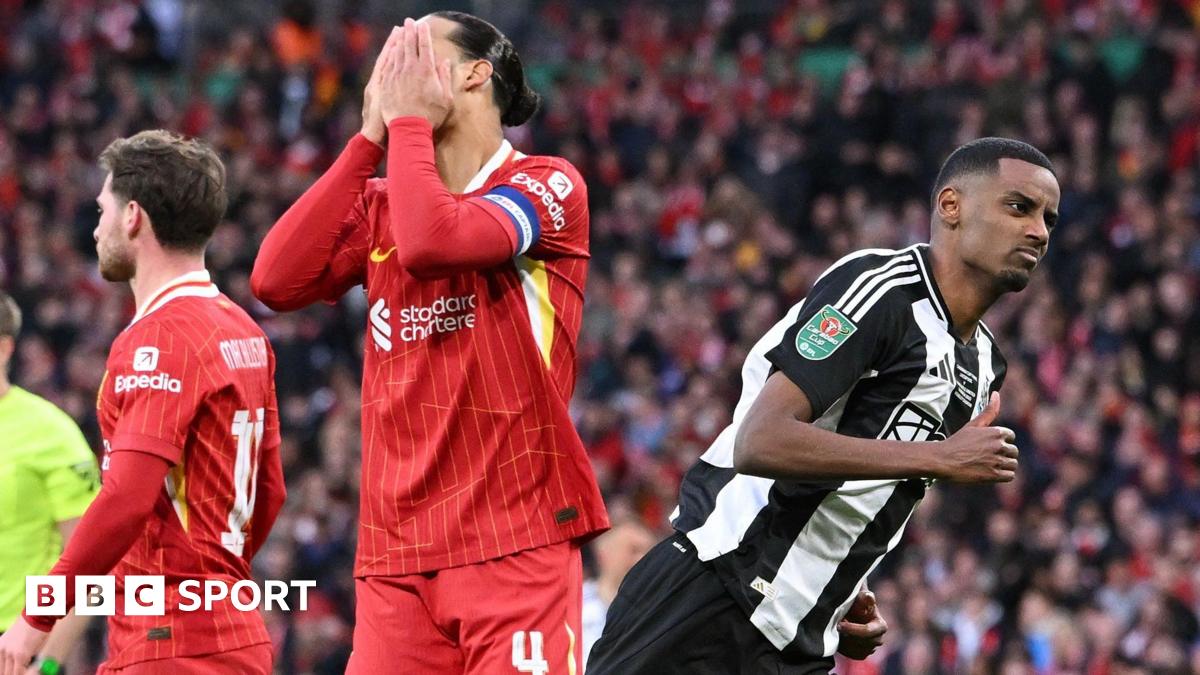 Alexander Isak in action for Newcastle United against Liverpool, running away from Virgil van Dijk, whose hands cover his own face