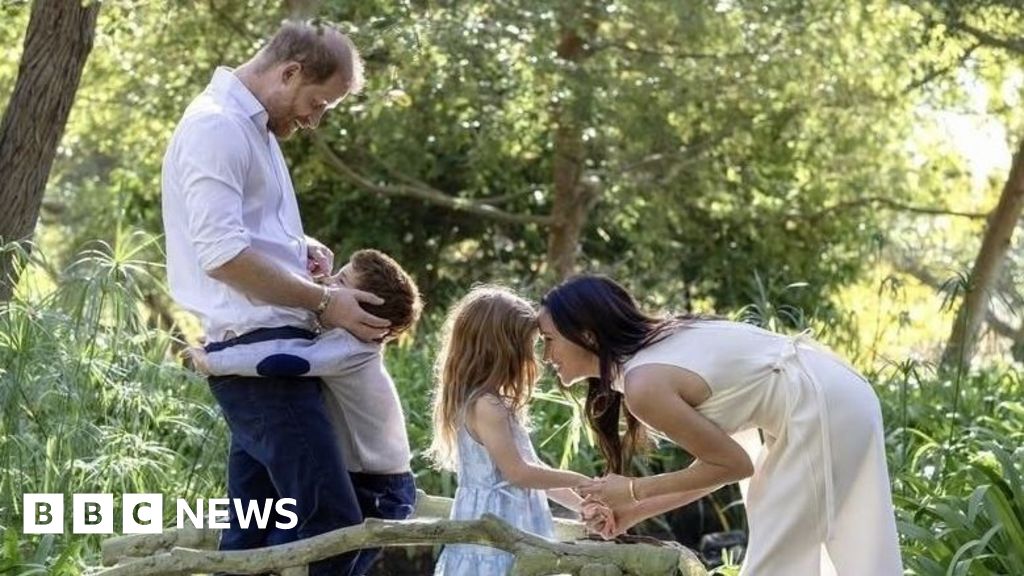 Harry and Meghan embrace children Archie and Lilibet in Christmas photo